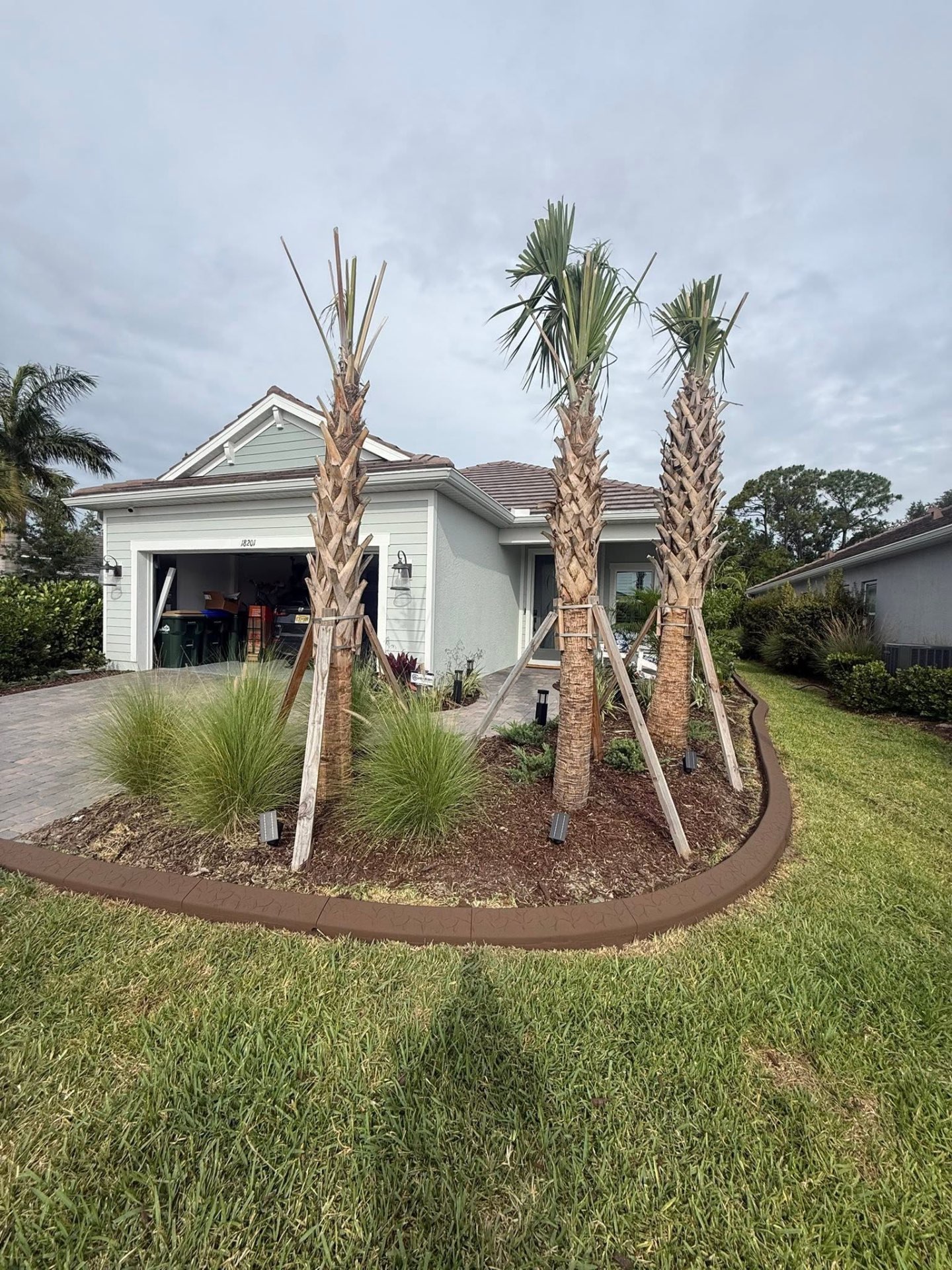 Palm island curbed with white rock